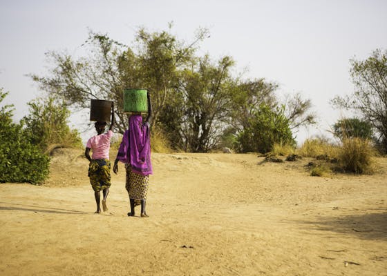 Women carrying water in Ghana