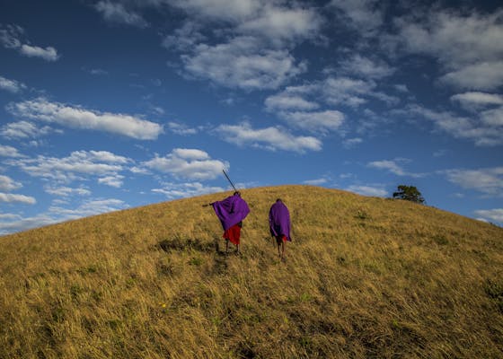Maasai guides who work with the Maasai Wilderness Conservation Trust, make their way up to the Chyulu Hills cloud forest