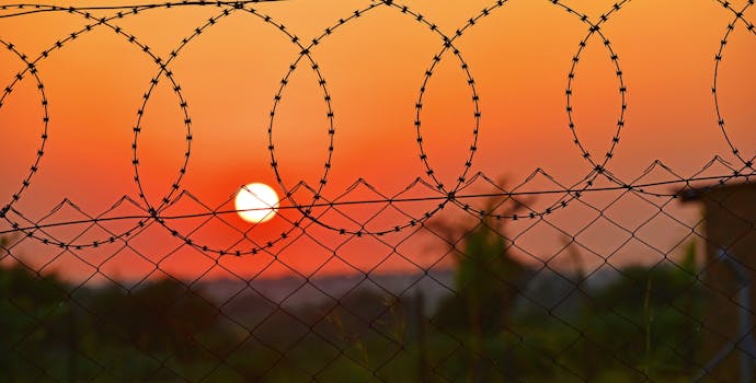Barbed wire fence and sunset, Eastern Cape, South Africa.